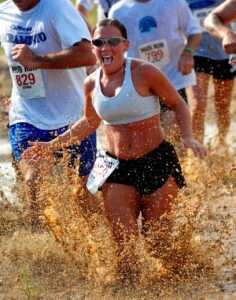 Woman racing in mud